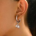 Vintage silver-plated drop earrings with elegant white faux pearls on model - Silver Round Hoop Pearl Style (C1660)