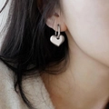 Vintage style heart drop earrings in silver finish on a model showing side profile - Silver Heart Dangle Style (C6938)