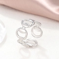 Macro shot of silver horsebit chain ring with polished finish on soft pink silk - Silver Horsebit Chain Open Style (C3730)