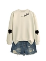 Detail of sweatshirt lucky lettering and clover sleeve print with distressed denim - Sand (Black Font)