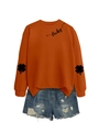 Detail of lucky text and clover prints on orange sweatshirt with denim shorts - Burnt Orange (Black Font)