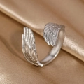 Adjustable silver feather ring with detailed wing texture on smooth satin background - Double Wing Style (N6526)