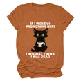 Close-up of rust red cotton t-shirt featuring a funny black cat drinking coffee print - Burnt Orange (White Text)