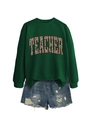 Detail of green crewneck sweatshirt with leopard print Teacher text and denim shorts - Dark Green