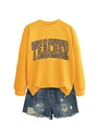 Close-up of mustard yellow crewneck sweatshirt featuring leopard print TEACHER lettering - Yellow