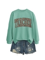 Detail of mint green long sleeve sweatshirt with leopard print teacher text and denim shorts - Light Green
