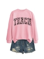 Flat lay of pink sweatshirt with TEACH heart print paired with denim shorts - Pink (Black Text)