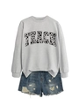 Detail of grey crewneck sweatshirt featuring TEACH lettering with heart patterns and denim shorts - Grey (Black Font)