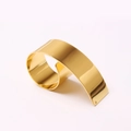 Polished gold metal ribbon napkin ring with elegant curved design and mirror finish - Gold Style