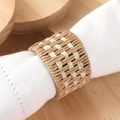 Handwoven rustic linen napkin ring with dual-tone texture on a white cloth napkin - Hemp Rope Woven Style