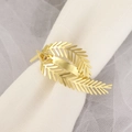 Elegant gold hollow leaf napkin ring on white fabric for table setting decoration - Hollow Leaf / Gold