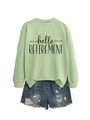 Detail of hello retirement print on light green long sleeve sweatshirt with denim shorts - Olive Green (Black Font)
