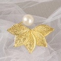Golden leaf napkin ring with large pearl detail on white lace background for table decor - Pearl Leaf Open Style / Gold