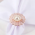 Rose gold hollow flower napkin ring with large central pearl and surrounding gems - Pearl Flower Napkin Ring