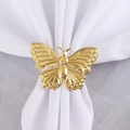 Rond de serviette papillon doré évidé avec finition miroir sur tissu blanc - Style Or Poli Miroir