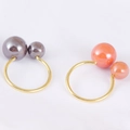 Elegante goldene Serviettenringe mit grauen und orangen Perlen für luxuriöse Tische - Rosa Perle U-Form-Stil