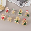 Set de 8 servilleteros de hombre de jengibre festivos en oro y plata para mesa navideña - Juego de Combinación de Hombre de Jengibre