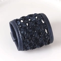 Detailed view of dark blue woven leather napkin ring with intricate braided texture - Navy Blue