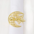 Golden moon and star napkin ring with Islamic hollow design on white fabric background - Hollow Moon Star Style