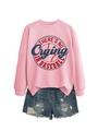 Detail of pink crewneck sweatshirt with vintage baseball print and ripped denim shorts - Pink