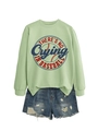 Flat lay of a green crewneck sweatshirt with retro baseball print and denim shorts - Olive Green