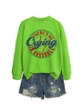 Detail view of neon green sweatshirt with baseball print and distressed denim shorts - Fluorescent Green