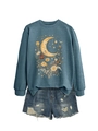 Detail of vintage navy sweatshirt with moon and floral print paired with ripped denim shorts - Blue