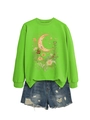 Detailed view of sage green moon and floral sweatshirt paired with frayed denim shorts - Fluorescent Green