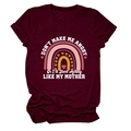 Close-up of printed slogan and rainbow design on maroon cotton crew neck T-shirt - S / Tops / Wine Red (White Text)