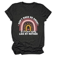 Detail of a charcoal cotton T-shirt featuring rainbow print and humorous text design - S / Tops / Black (White Text)