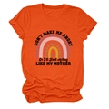 Detail of soft orange cotton T-shirt featuring rainbow print and humorous quote text - S / Tops / Orange (Black Text)