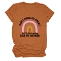 Detail of caramel cotton T-shirt featuring rainbow print and humorous quote text - S / Tops / Burnt Orange (Black Text)