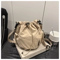 Detail of drawstring bucket bag with side mesh pocket and adjustable nylon strap - Khaki
