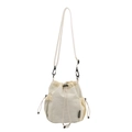 Minimalist cream nylon bucket bag with drawstring closure and side mesh pocket detail - White