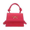 Elegante borsa a mano magenta con fiocco dorato e manico a nodo particolare - rosa acceso