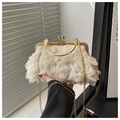 Detail of white 3D floral evening bag with delicate chiffon roses and gold metal handle - Off White