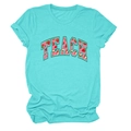 Close-up of teal cotton t-shirt featuring TEACH text with strawberry pattern print - Deep Water Blue