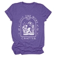 Detail of purple cotton T-shirt featuring 'Just One More Chapter' skull graphic print - Purple (White Text)