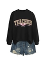 Close-up of black sweatshirt with floral TEACHER lettering and pink bow design - Black