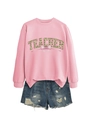Detail of pink teacher sweatshirt with clover print and denim shorts set on white background - Pink