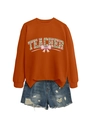 Detail of orange teacher sweatshirt with clover pattern and distressed denim shorts - Burnt Orange