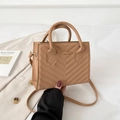 Khaki quilted crossbody bag with V-shaped stitching and golden JINGPIN logo - Tan