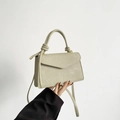 Minimalist light mint green crossbody bag with knotted handle and gold-tone hardware - Green