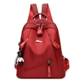 Deep red waterproof fashion backpack for women with a cute panda charm accessory - Red