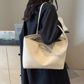 Large beige tote bag with textured faux leather and shoulder straps for daily commute - Off-white