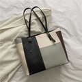 Bolso de mano de cuero PU con bloques de color negro, blanco y marrón y correas ajustables - Gris