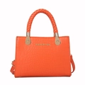 Chic orange faux crocodile handbag featuring a braided handle and golden hardware accents - Orange