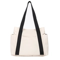 Detail view of large cream canvas tote bag with black straps and functional side pockets - Off White