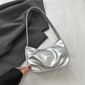 Silver metallic gathered hobo bag with fashion logo plaque on a grey blazer background - Silver