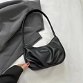 Minimalist black baguette shoulder bag with cloud pleats and crescent moon shape - Black
